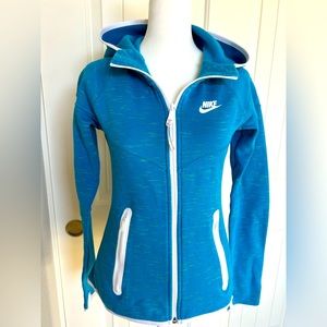 EUC NIKE hooded jacket with full front zip and pockets zipped. Flattering fit